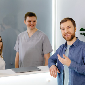 A man preparing to pay for his dental care