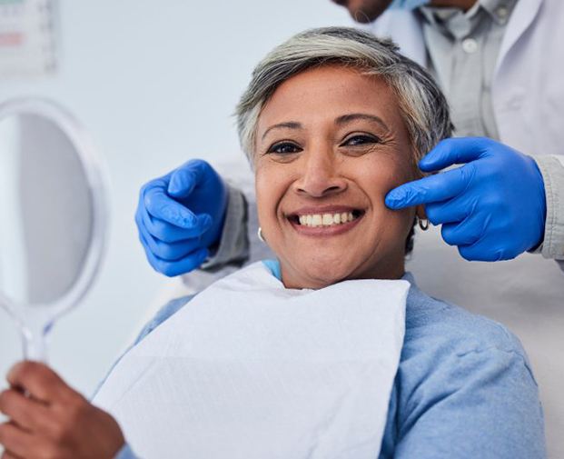 Female patient smiling at the dentist’s office