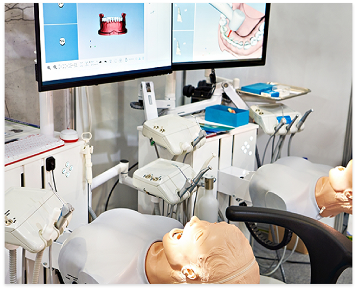 Row of practice dental treatment stations in a dental education facility