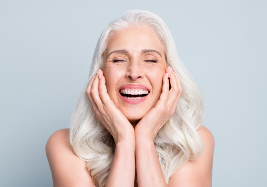 Woman smiling with dental implants